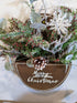 Handmade wooden merry Christmas box with winter greenery and berries
