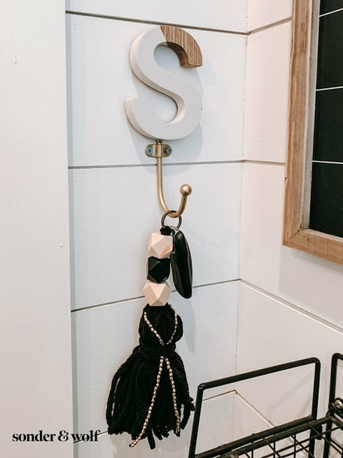 Geometric Keychain with Black Tassels